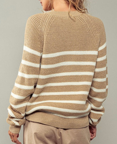 Textured tan sweater with  large white stripes across the torso.