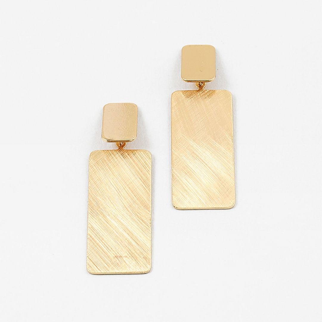 Large brushed gold rectangular earrings on a white background
