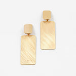 Large brushed gold rectangular earrings on a white background