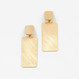 Large brushed gold rectangular earrings on a white background