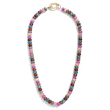 Multicolored beaded necklace in mauve, red, blues and greens on a white background