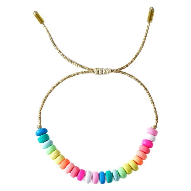 Adjustable woven bracelet with bright colored beads in pinks, yellows, greens and blues.