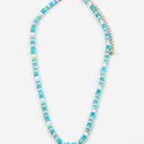 Necklace with blue and white beads on a white background
