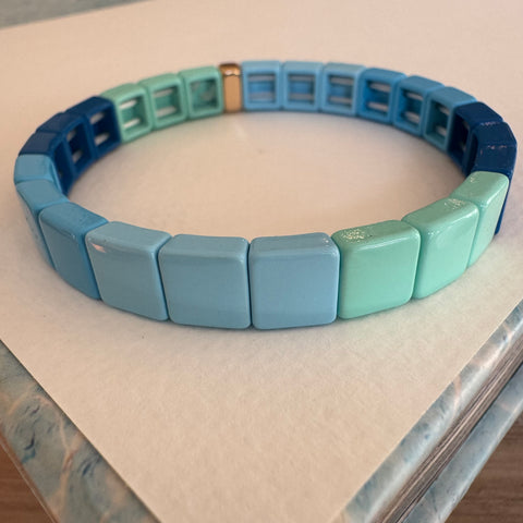 Square bead bracelet in ombre shades of muted blue.