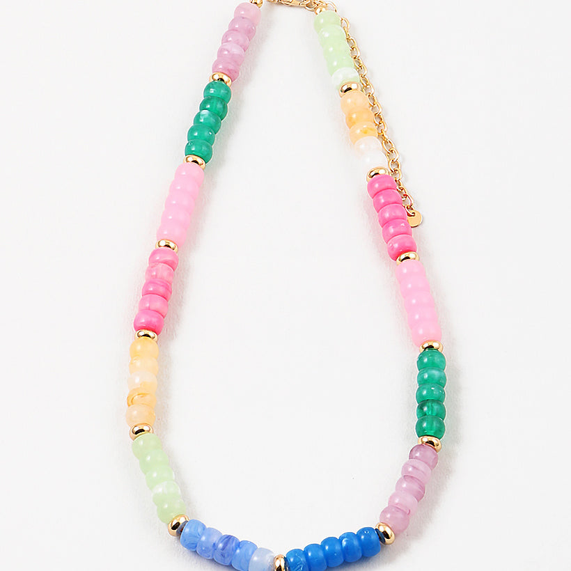 Picture of a multicolored beaded necklace in pinks, blues, greens and yellows with gold accent beads every 5th bead.