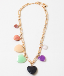 A gold-tone necklace with a series of multicolored heart-shaped charms and a signature gold link chain.