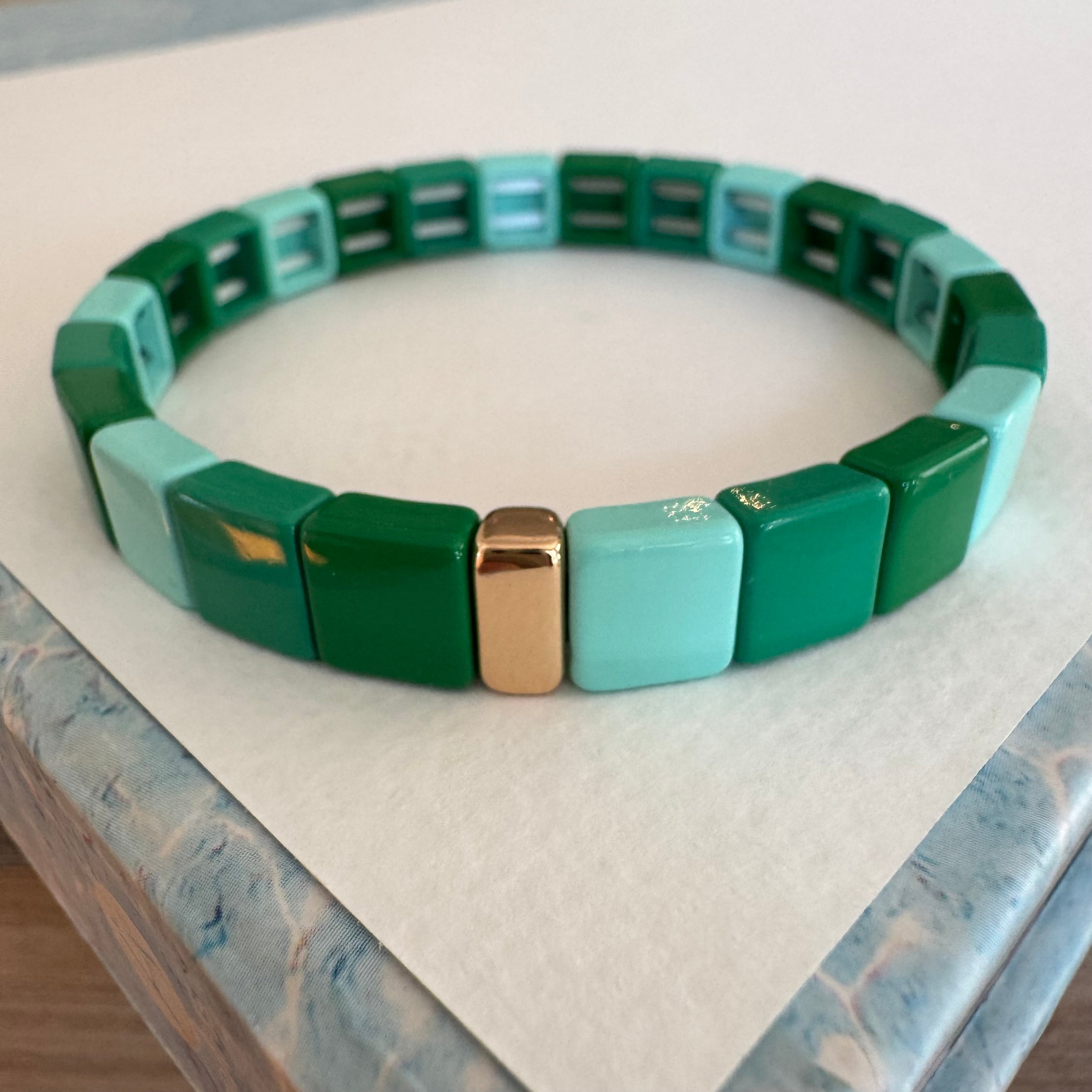 Square bead bracelet in shades of ombre green.