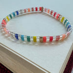 Colorful beaded bracelet on a white surface