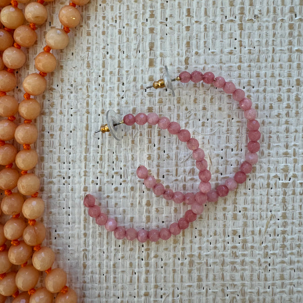 Large pink beaded hoop earrings
