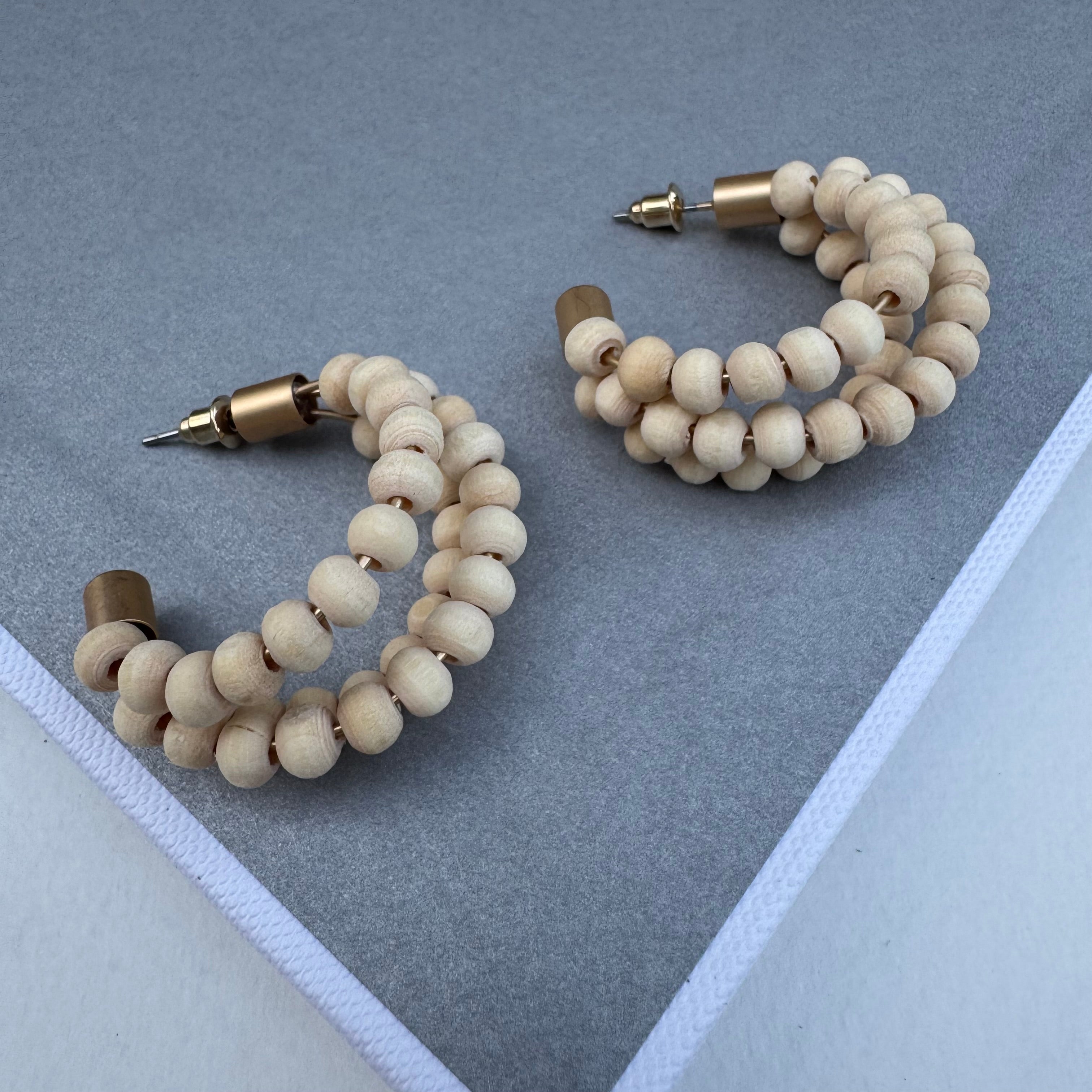 Set of hoops made of three strands with small wooden beads