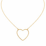 Gold heart-shaped necklace on a white background