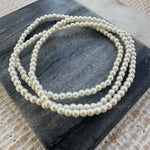 Picture of three pearl bead bracelets.