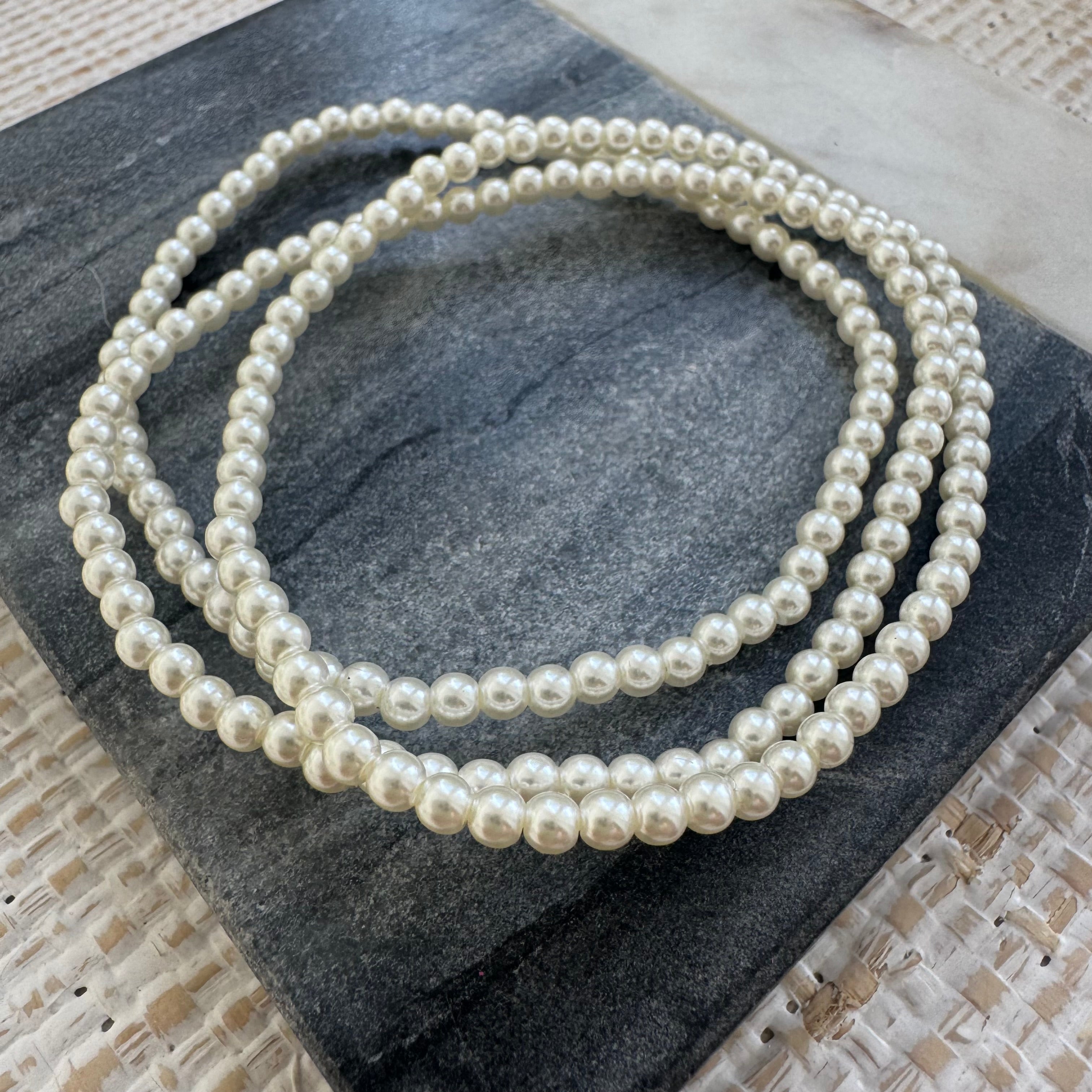 Picture of three pearl bead bracelets.