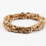 A set of gold-colored square stretch bracelets displayed against a white background.