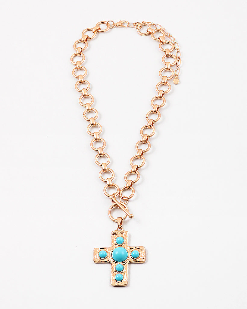 Large circle link gold chain with a toggle clasp. Necklace has a gold Cross with turquoise beads set in it as a pendant.