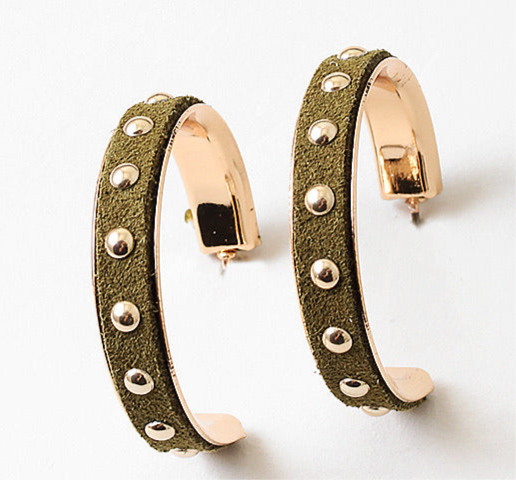 Pair of green suede hoop earrings with rose gold accents and studded details on a white background