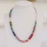 Green, blue, purple, red, brown and pink colored beaded necklace.