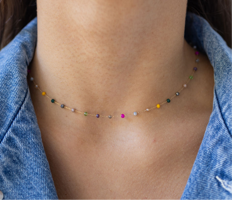 Picture of model wearing a delicate choker with tiny multicolored beads.