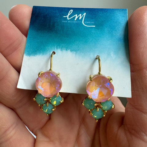 Picture of a pair of coral gem earrings with a set of three Mint green gems on the bottom.