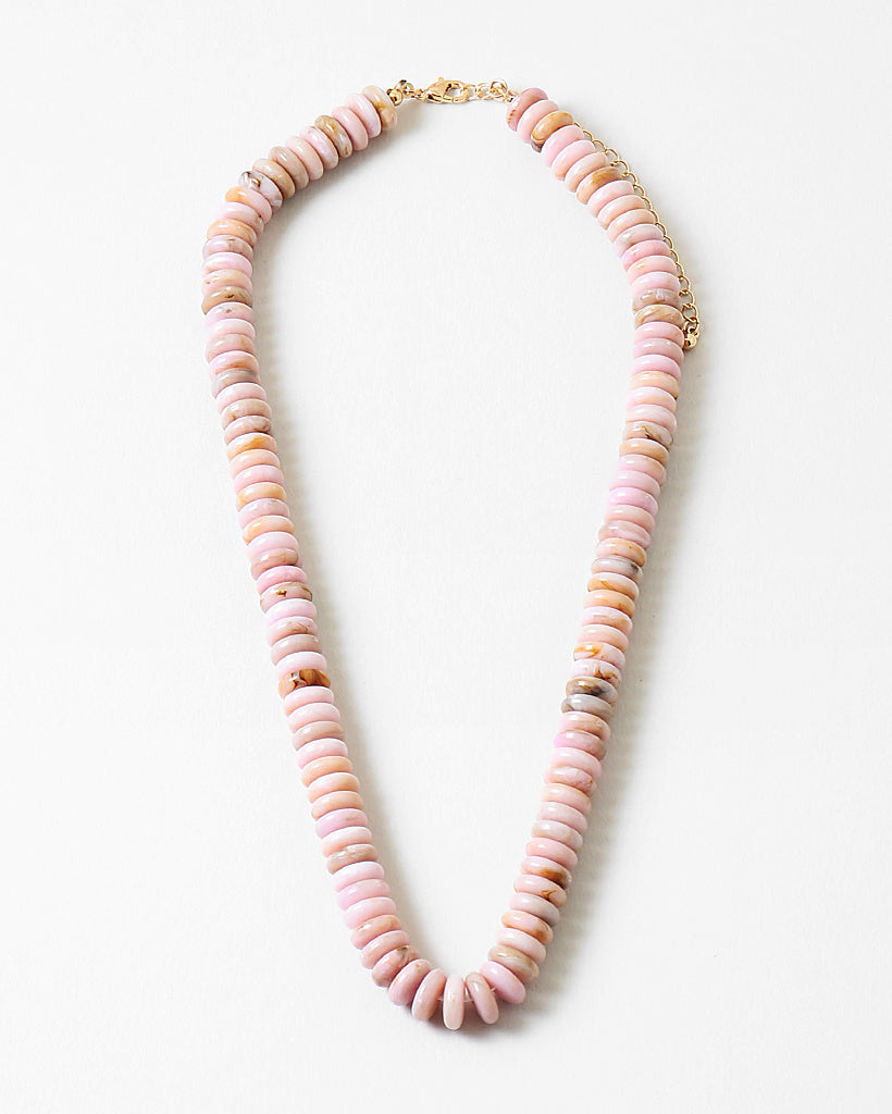 Necklace with pink beads on a white background