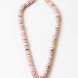 Necklace with pink beads on a white background