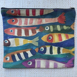 Small pouch with colorful fish pattern on a textured fabric background