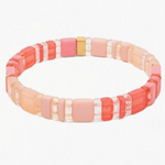 Picture of bracelet made of clear and solid rectangle beads in shades of coral.