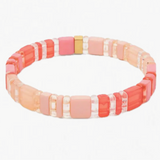 Picture of bracelet made of clear and solid rectangle beads in shades of coral.