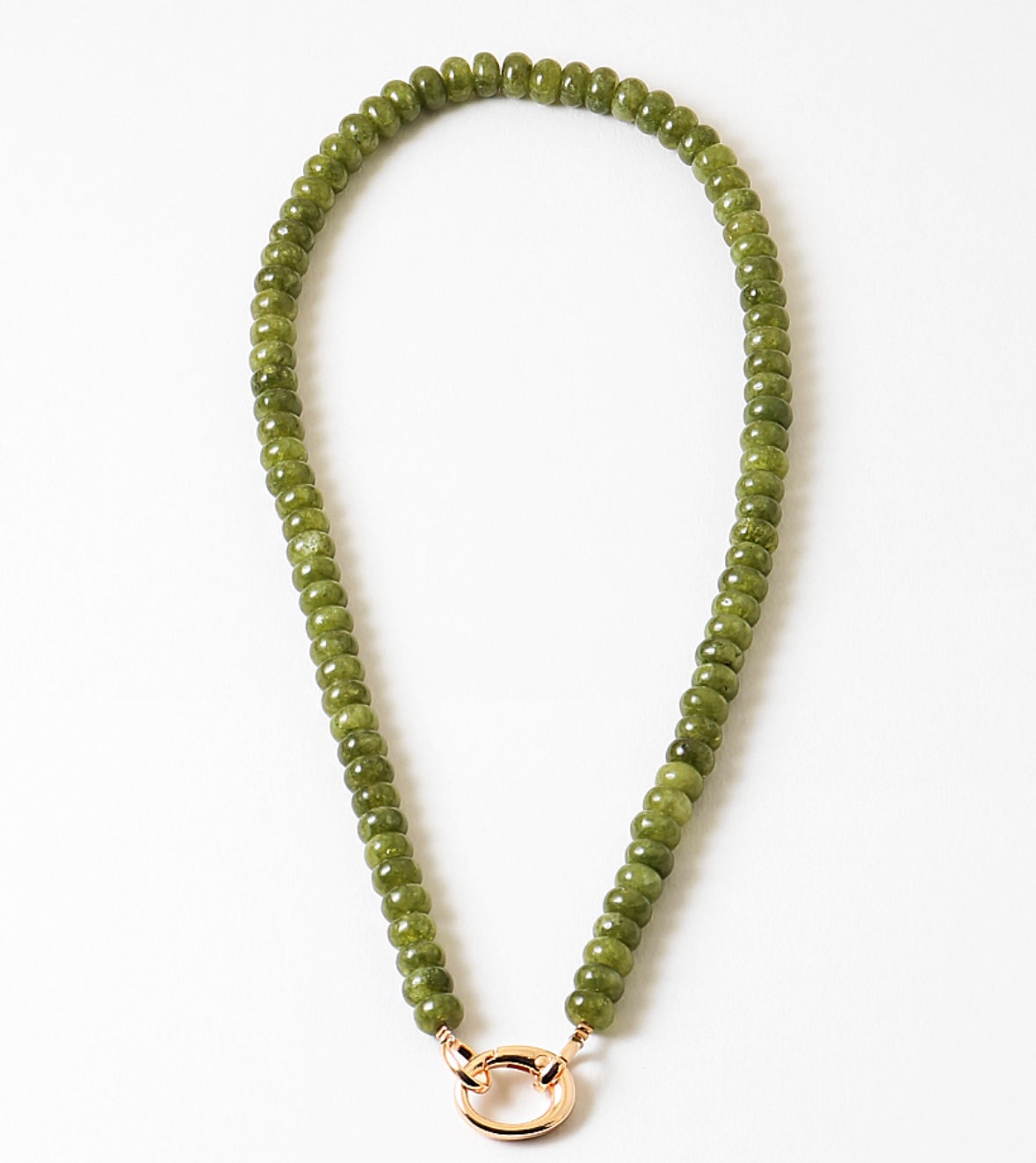 Green beaded necklace with a gold clasp on a white background