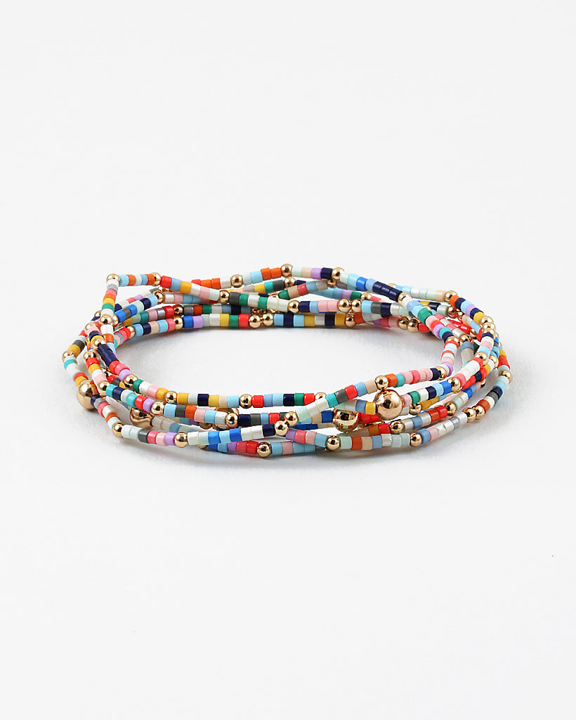 Picture of layered multicolored seed beaded bracelet with gold spacer beads.