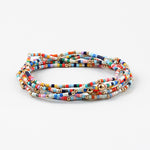 Picture of layered multicolored seed beaded bracelet with gold spacer beads.