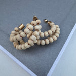 Set of hoops made of three strands with small wooden beads