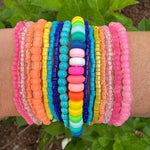 Beautiful set of 16 beaded bracelets. Bracelets are pink, orange, blue, turquoise, yellow and multicolored.