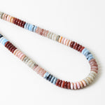 Necklace with multicolored beads on a white background