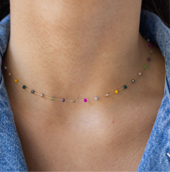 Picture of model wearing a delicate choker with tiny multicolored beads.