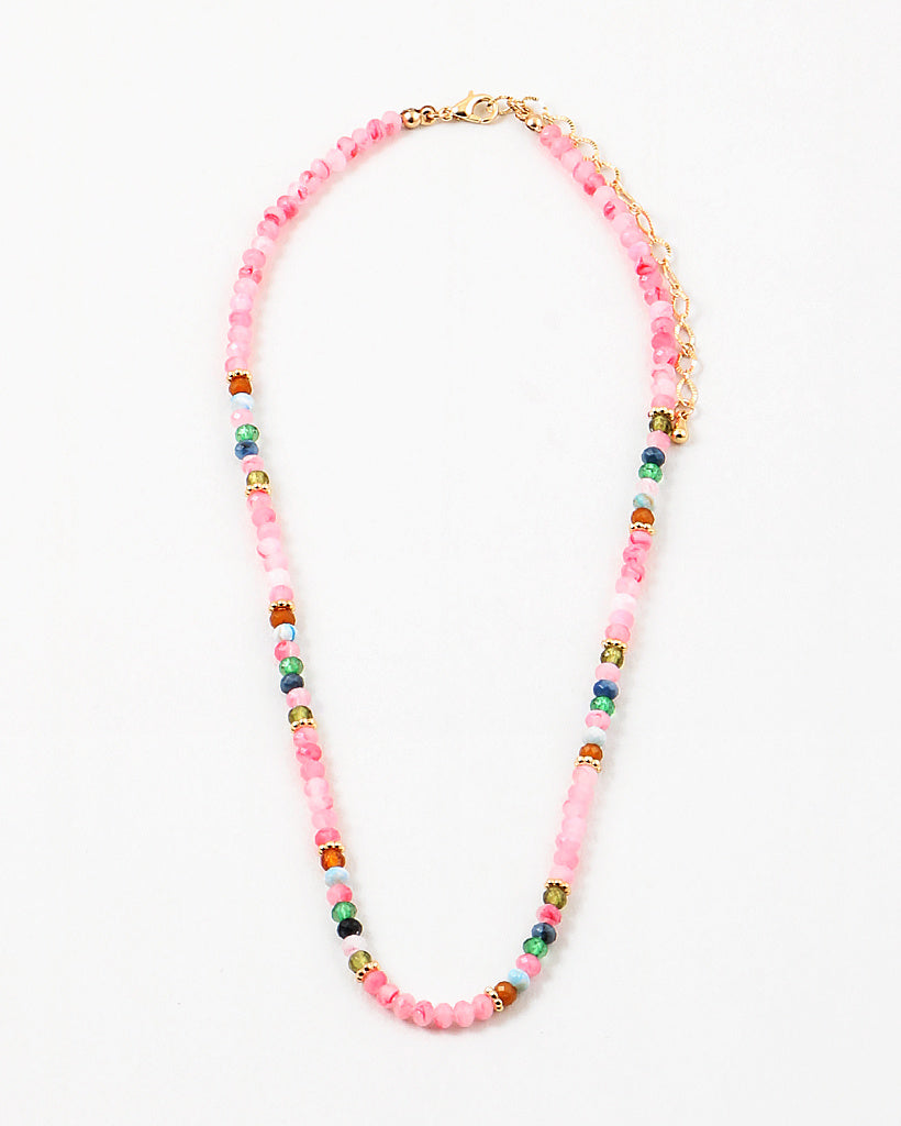 Pink bead necklace with accenting red, blue, white and navy beads.