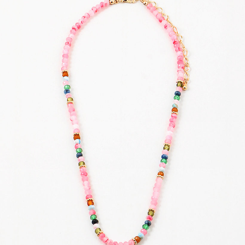 Pink bead necklace with accenting red, blue, white and navy beads.