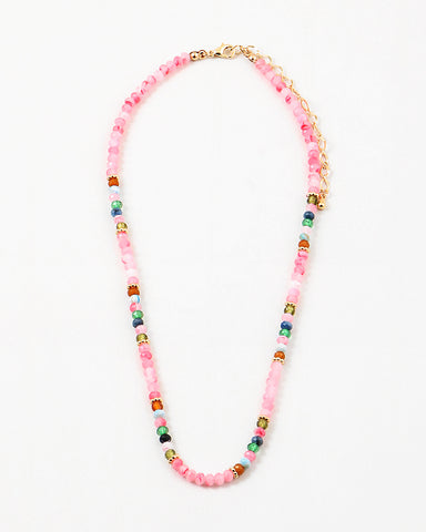 Pink bead necklace with accenting red, blue, white and navy beads.