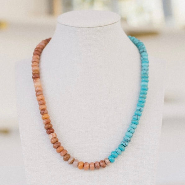 Picture of amber and clay beads and turquoise beaded necklace.