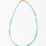Delicate bead necklace with turquoise beads and small gold accent beads.