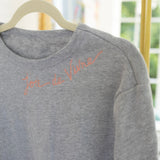 Embroidered Joie de Vivre Sweatshirt