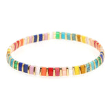 Bracelet with multicolor rectangle beads with gold spacer beads.