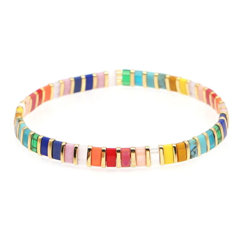 Bracelet with multicolor rectangle beads with gold spacer beads.