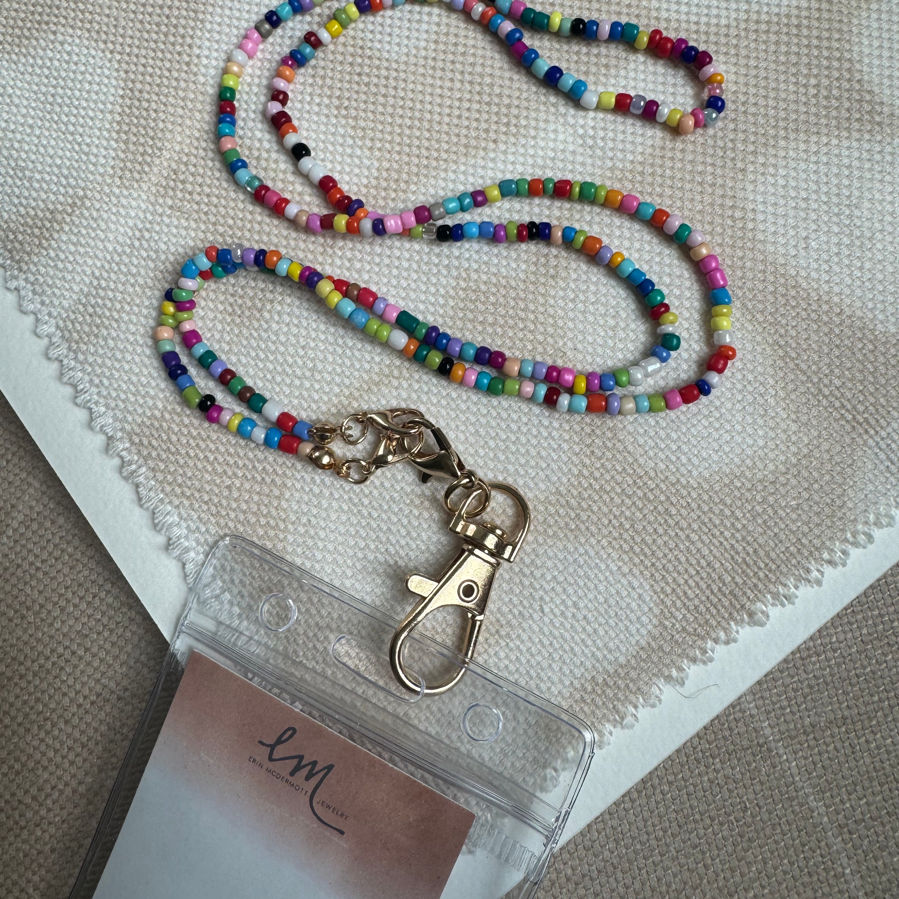 Picture of a multicolored beaded lanyard attached to a tag holder.