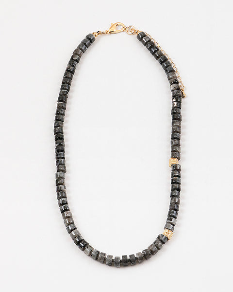 Picture of a gray bead necklace with gold accent beads.