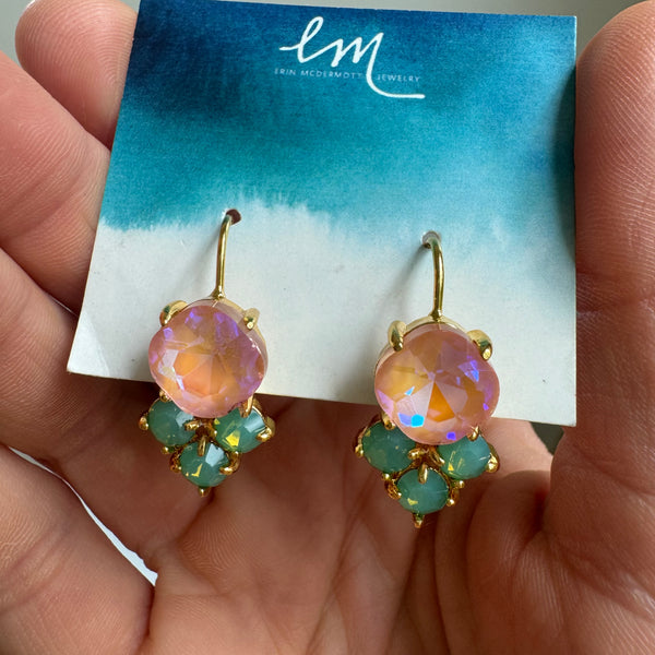Picture of a pair of coral gem earrings with a set of three Mint green gems on the bottom.