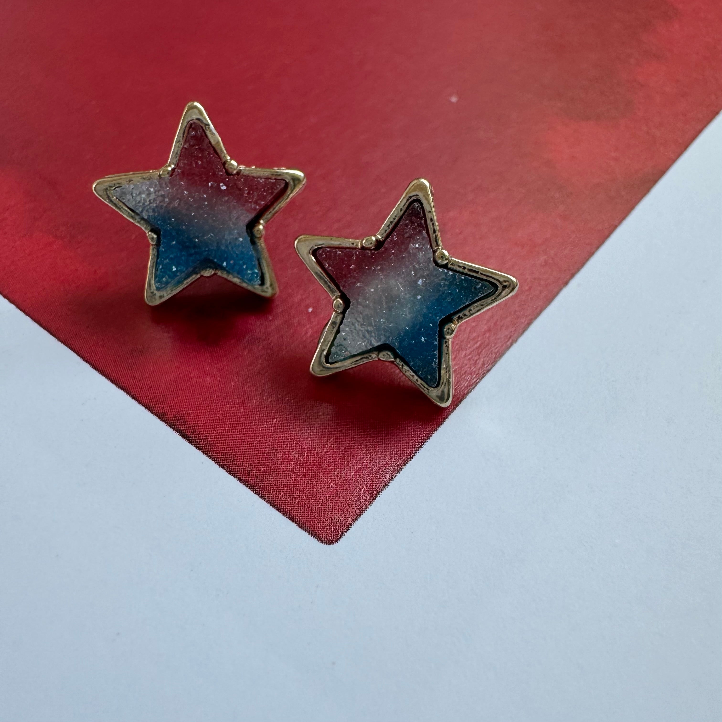 Pair of star studs with red, white and blue druzy stone interiors.