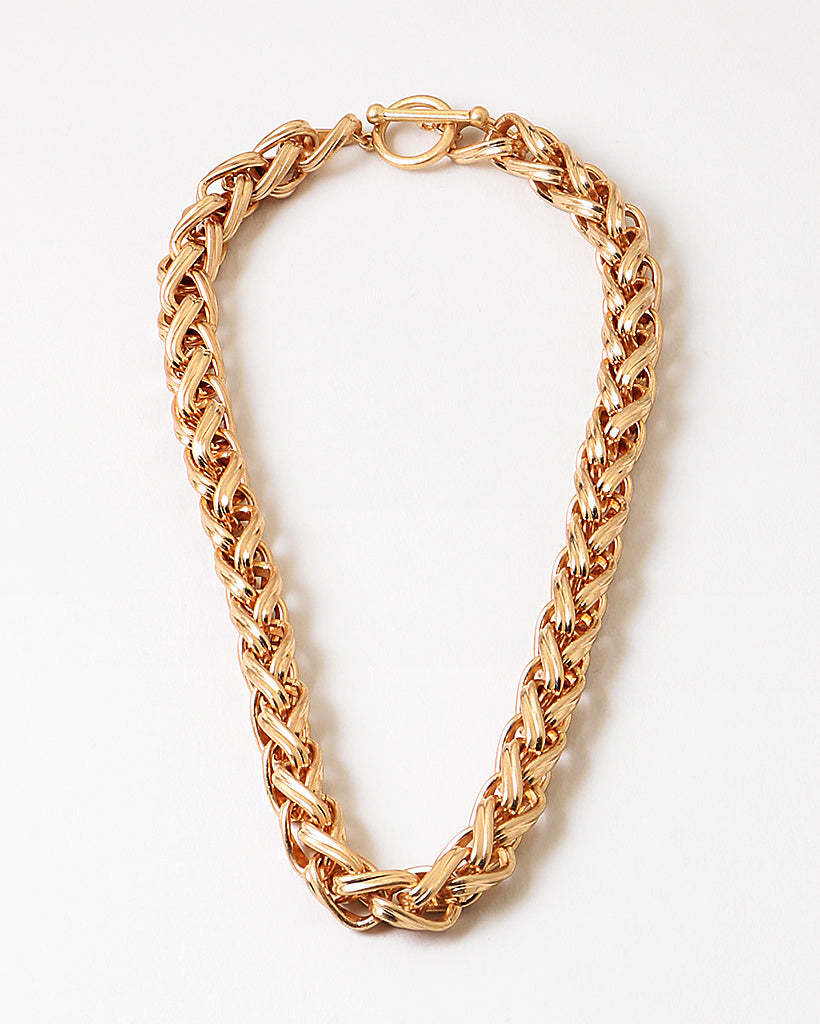 Gold chain necklace on a white background