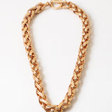 Gold chain necklace on a white background