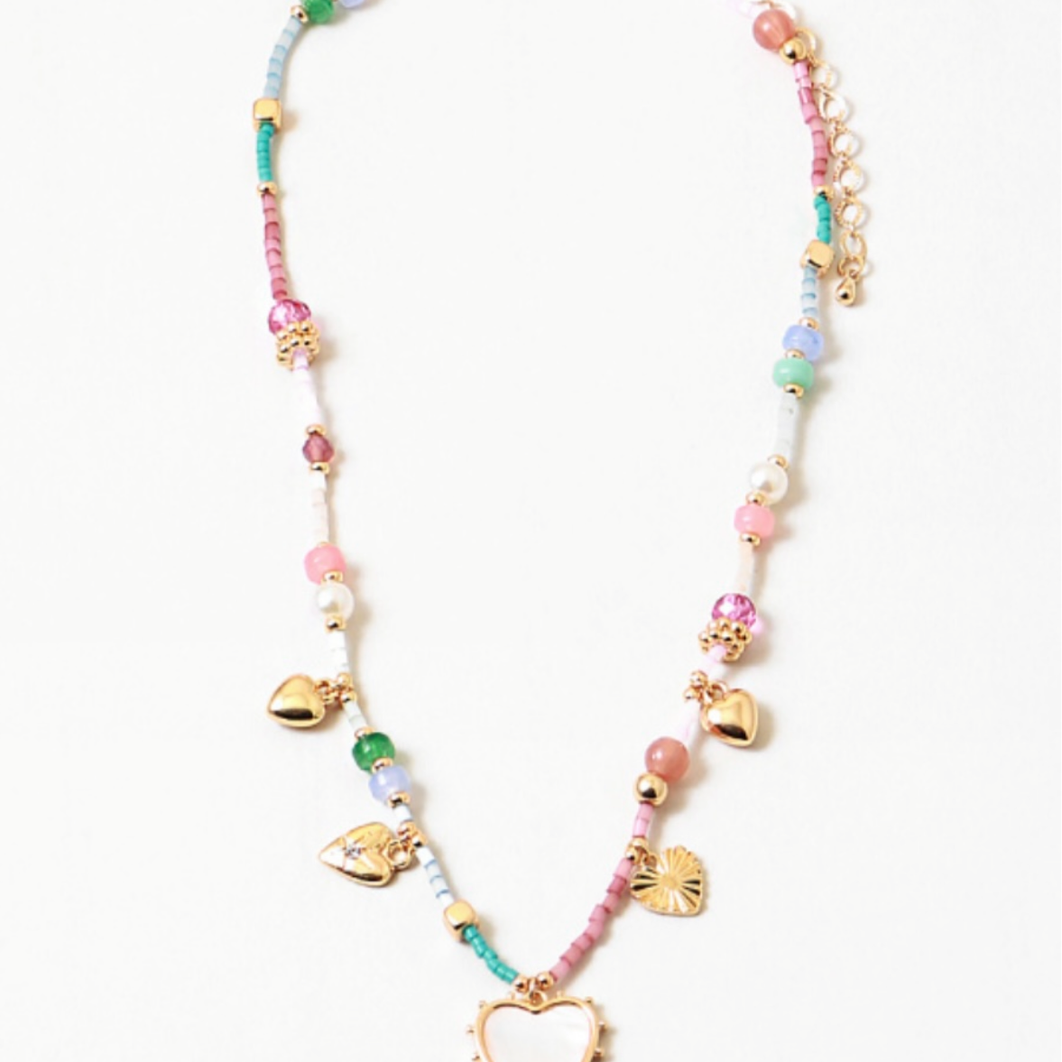 A colorful necklace with a mix of heart-shaped charms and dreamy pink and turquoise colors, displayed against a plain background.